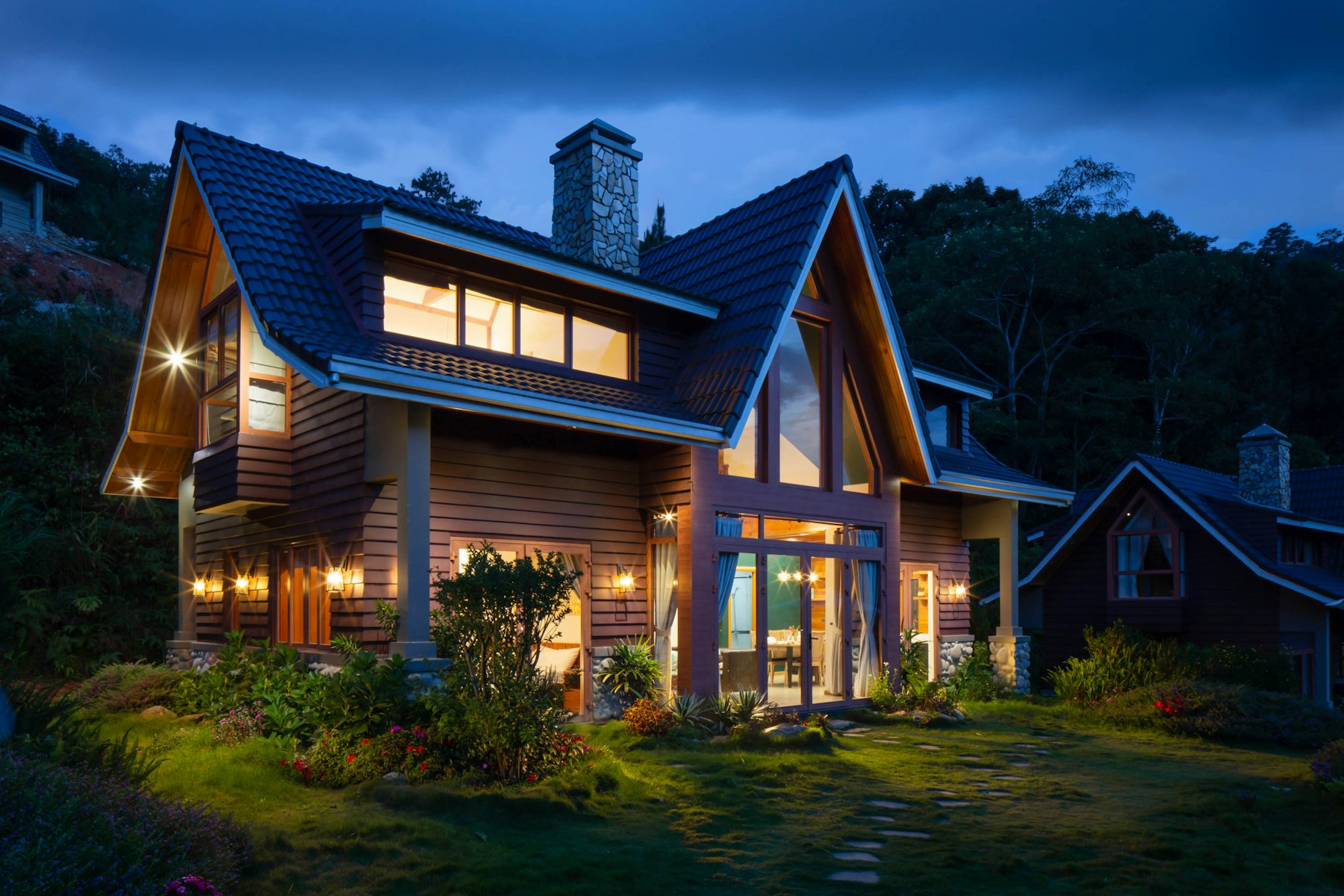 A warmly lit home at dusk